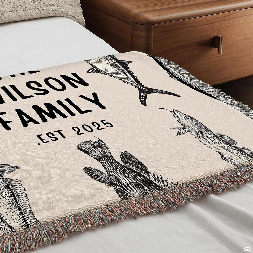 Full display of vintage fish engraving lakehouse throw blanket laid flat on light wooden floor