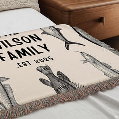 Full display of vintage fish engraving lakehouse throw blanket laid flat on light wooden floor