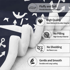 Close view of ship helm rope-wound anchor and nautical star motifs on blanket