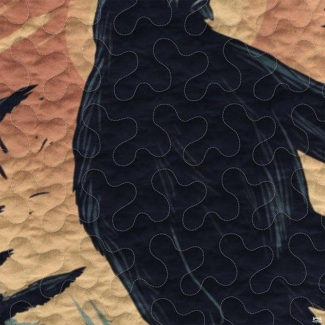 Close-up view of Bigfoot bedding showcasing peach terracotta sunrise, pine trees, and Sasquatch silhouette