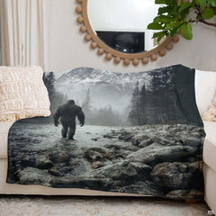 Bigfoot walking through a rocky mountain river toward snow-capped peaks, view 6.