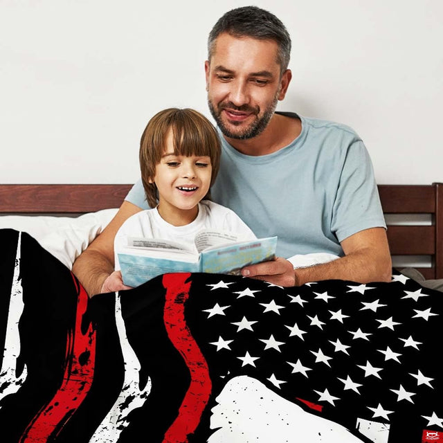 Patriotic Bigfoot American flag throw blanket view 2 styled on living room couch in rustic lodge home