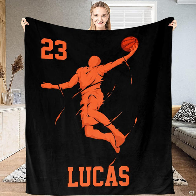Dynamic orange basketball slam dunk artwork displayed across bedding set in a modern bedroom setting.