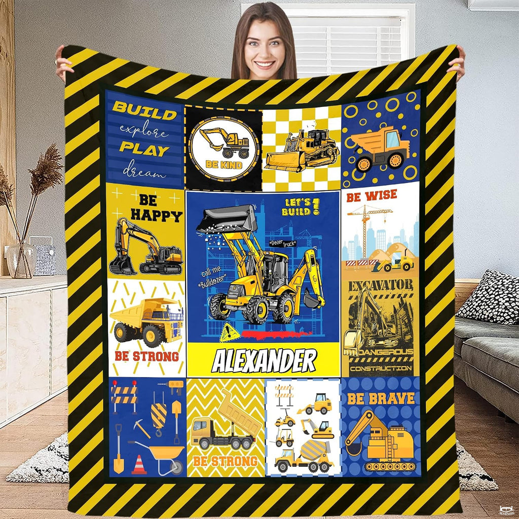 Patchwork vehicle theme layout with yellow diggers and checkered geometric patterns.