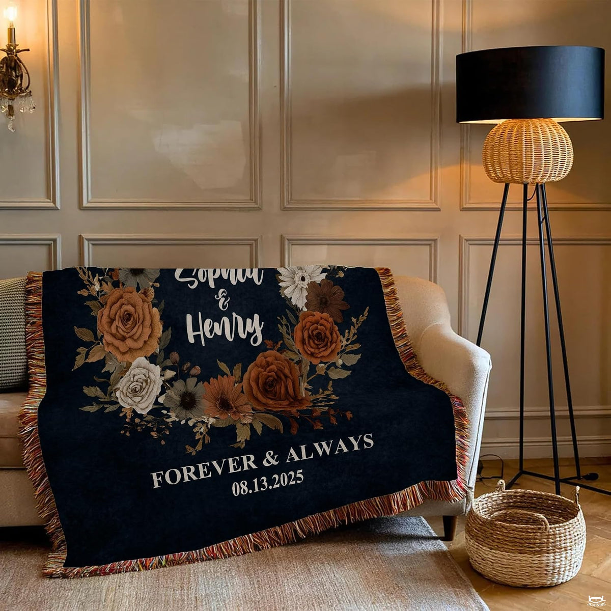 Close-up of terracotta roses, cream daisies, and dried botanical foliage on a dark navy blanket