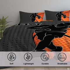 Corner angle view of athletic bedding illustrating crisp graphic contrast between orange and charcoal gray