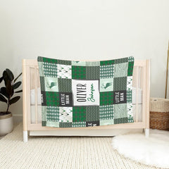 Woodland throw blanket draped over vintage wooden rocking chair in rustic cabin nursery