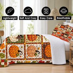 Matching pillow shams displaying miniature patterned pumpkins and autumn foliage on a bedding set