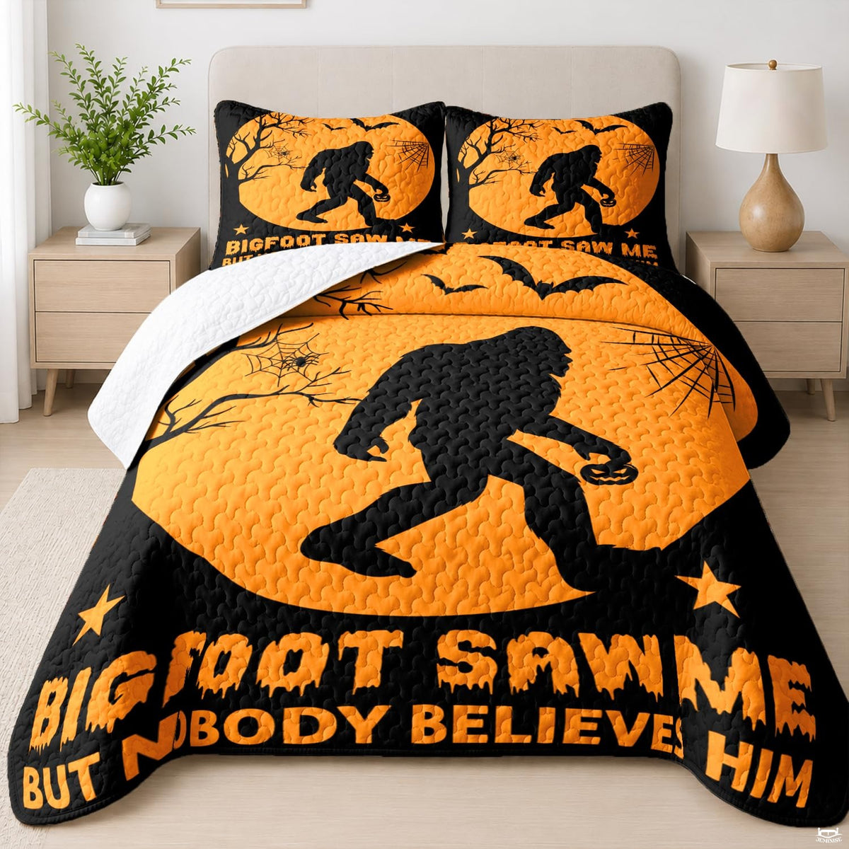 Halloween bed covers showing thematic accent silhouette carrying a pumpkin bucket beneath an orange harvest moon.