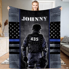 Armored tactical police officer Thin Blue Line blanket held upright