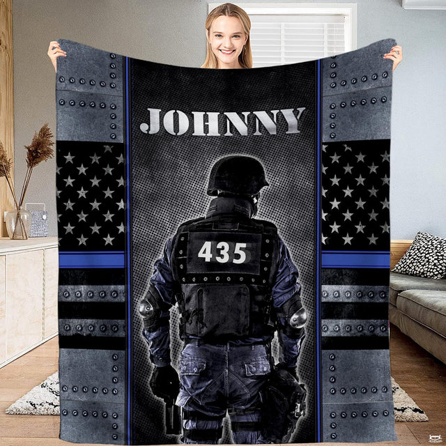 Armored tactical police officer Thin Blue Line blanket held upright