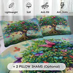 Close-up detail of botanical patchwork bedding displaying stylized tree of life leaves, butterflies, and plum wine accents.