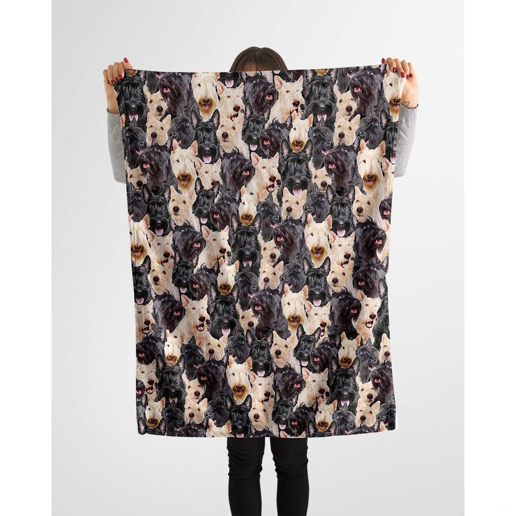 Scottish Terrier photo collage blanket styled across a couch in a room.
