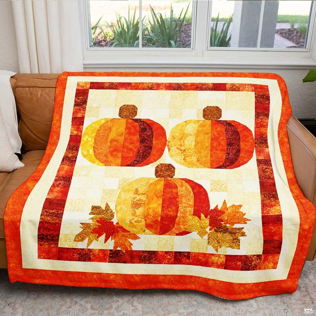 Country farmhouse living room decor featuring three pumpkins throw blanket