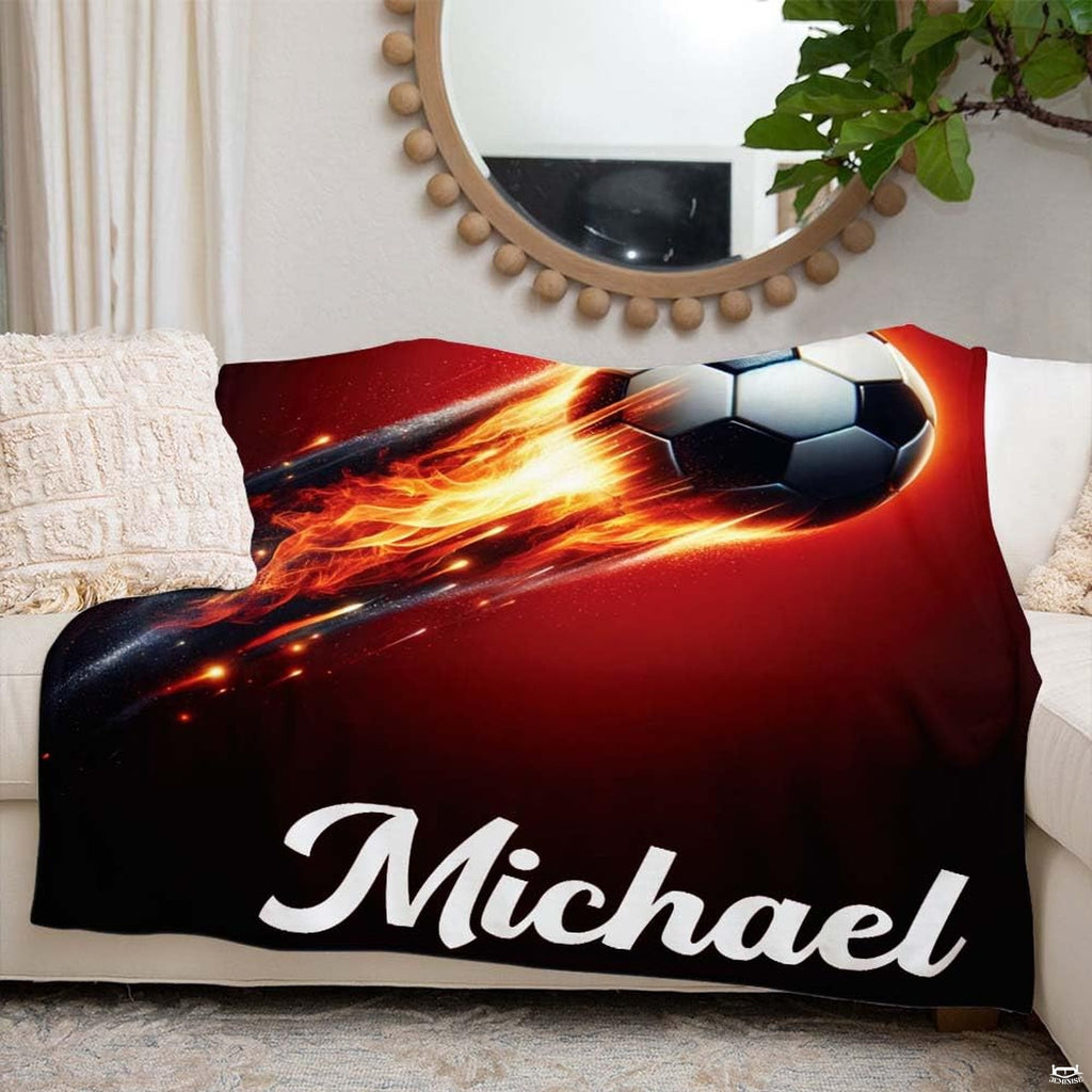 Living room couch arrangement highlighting the complete fiery soccer ball graphic print.