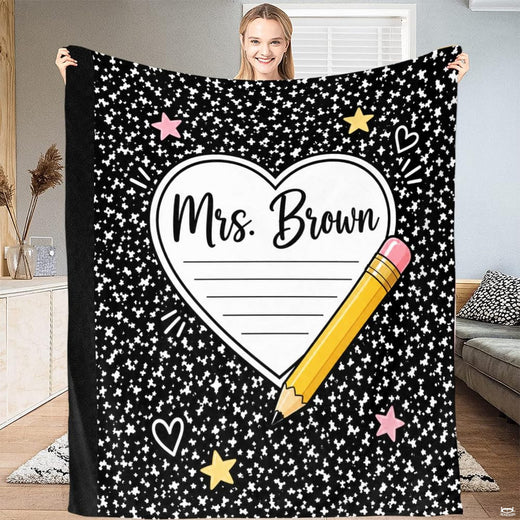 Teacher appreciation throw blanket featuring a notepad heart, yellow pencil, and stars on black