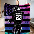 Person displaying the football player and cosmic galaxy flag print.