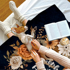 Autumn floral wreath navy throw blanket folded neatly showing rich autumn floral wreath composition