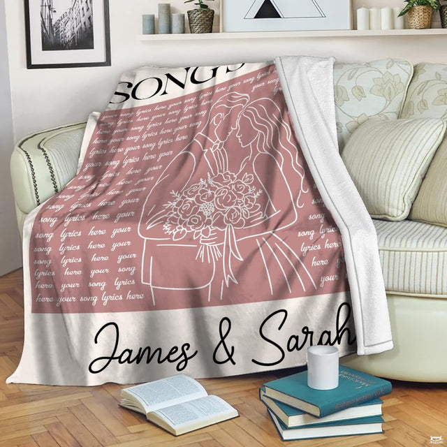 Living room display with the dusty rose bridal illustration graphic draped over a sofa.