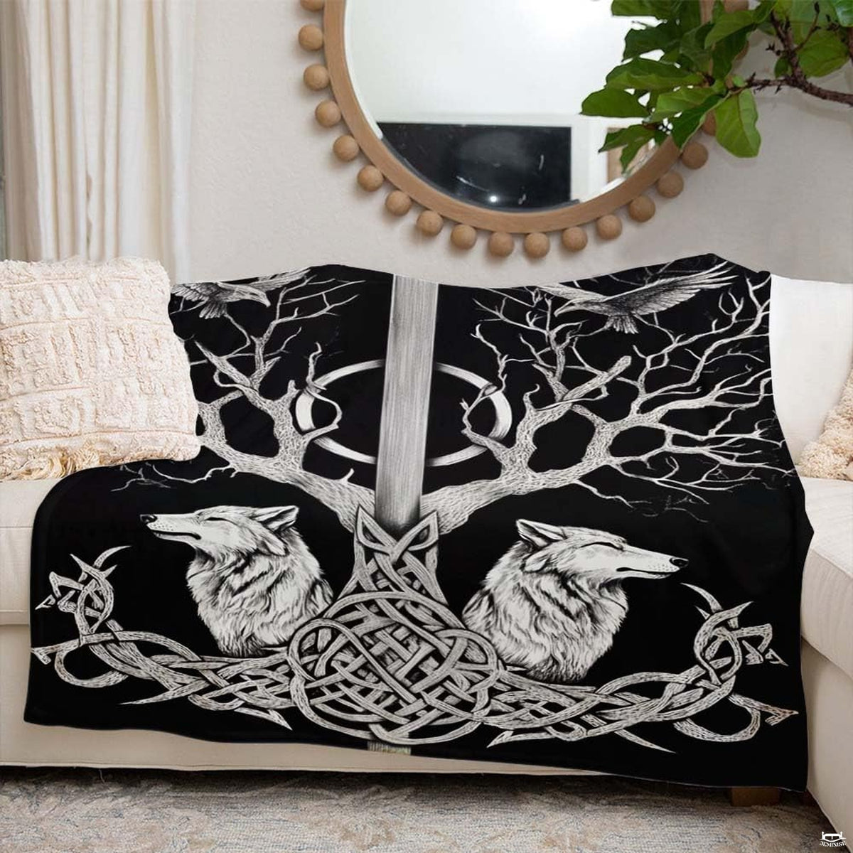 Living room decor setting featuring Viking sword and wolves throw blanket