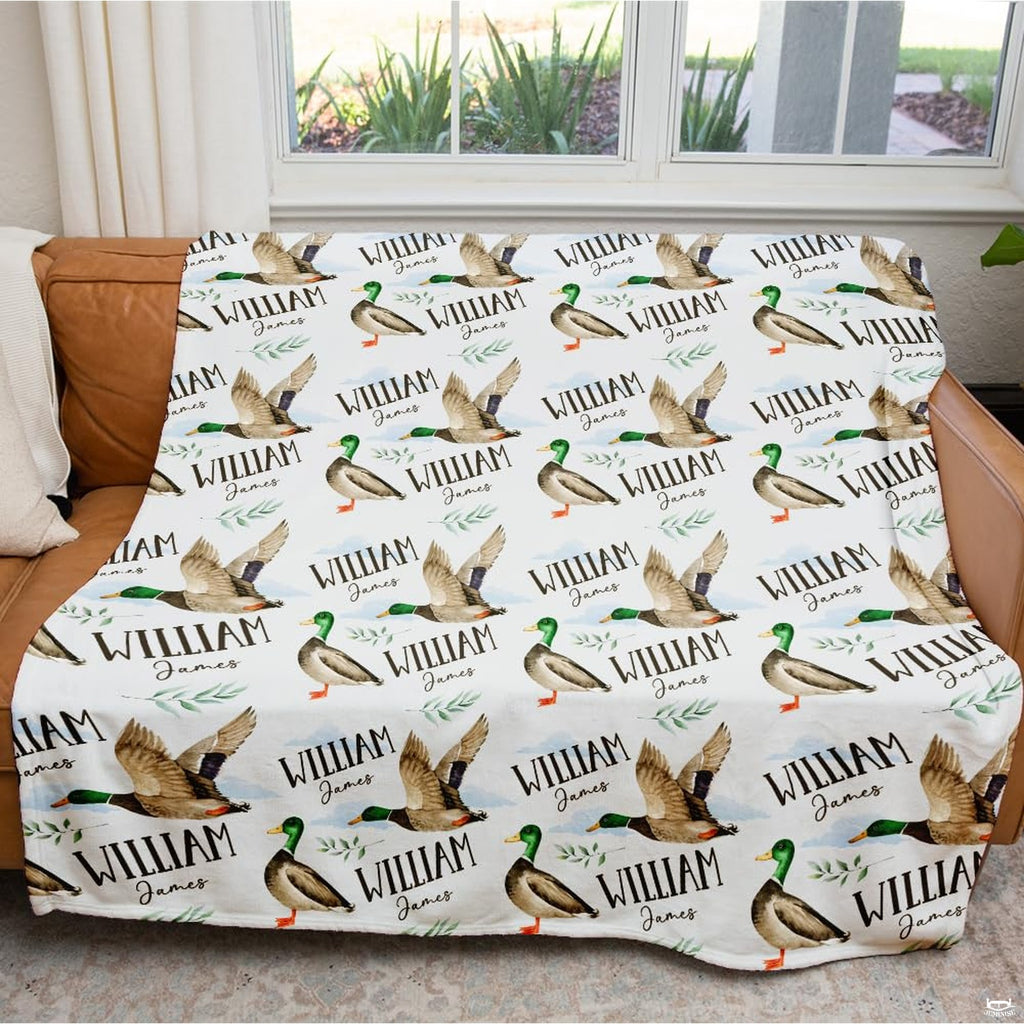 Close-up of mallard duck illustrations featuring orange webbed thematic accent, rich green heads, and green foliage prints