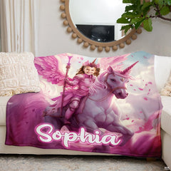 Pink unicorn blanket arranged on cream living room sofa beneath round mirror