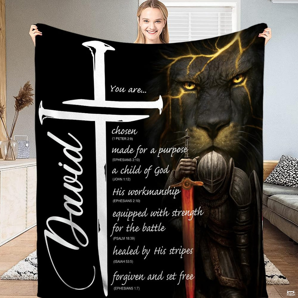 Bedding displaying a dark lion with gold glowing veins, an armored knight with fiery sword, and white cross.