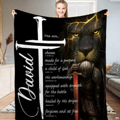 Bedding displaying a dark lion with gold glowing veins, an armored knight with fiery sword, and white cross.