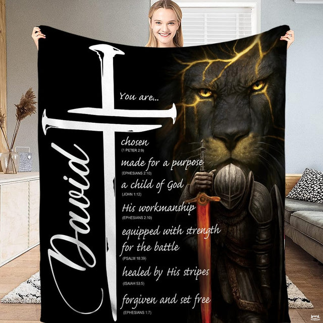 Bedding displaying a dark lion with gold glowing veins, an armored knight with fiery sword, and white cross.