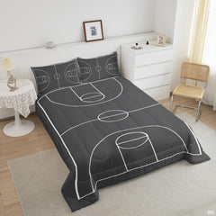 Close-up view of soccer bedding showcasing athletic cleats, soccer ball graphics, and charcoal tones