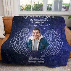 Bedroom setting featuring cosmic night sky artwork with smiling portrait framed by angelic wings.