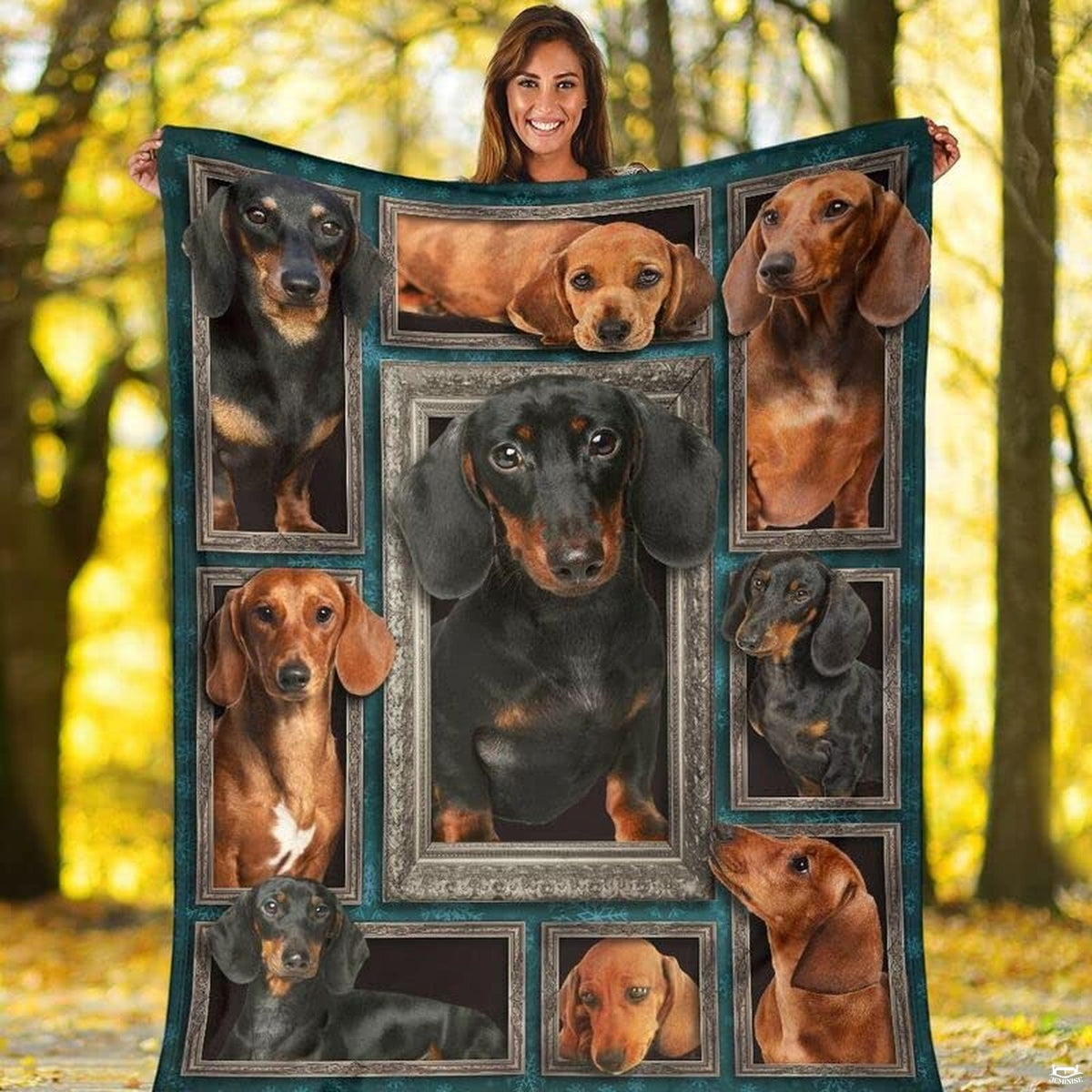 Outdoor view of a model holding up the full Dachshund gallery throw blanket.
