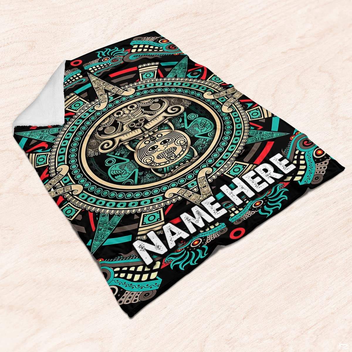 Centered sun stone calendar graphic displayed prominently across the aztec crib bedding set artwork.