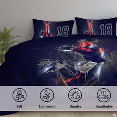 Overhead view of athletic bed sheets displaying dynamic leaping player artwork and crimson varsity motifs.