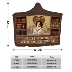 Close-up detail of heart bookcase and reading girl illustration on throw blanket