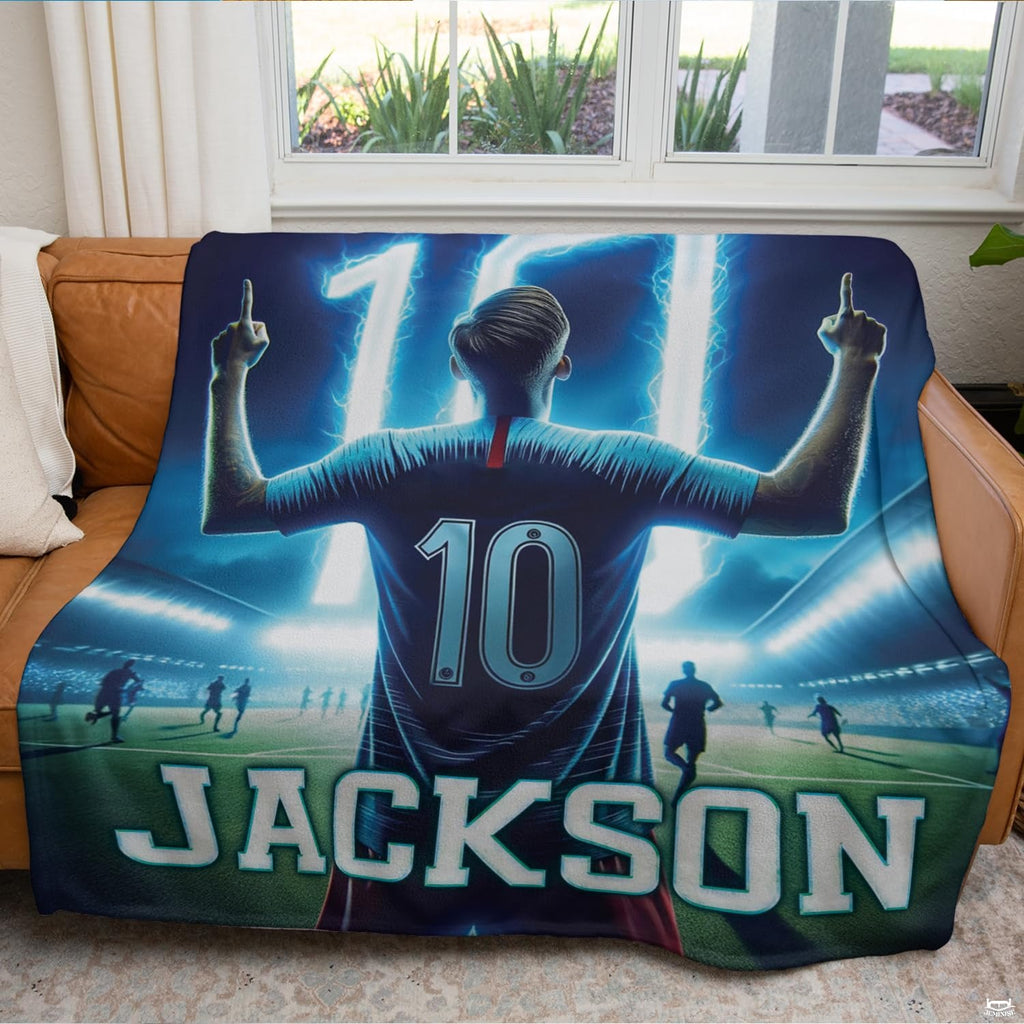 Rear view of a celebrating football player pointing upward on stadium themed bedding.