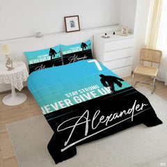 Detailed view of cyan split-tone graphics and stylized script artwork featured on dynamic ice hockey bedding.