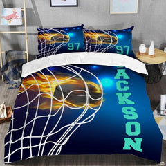 Top-down view of fire and ice hockey puck bedding set arranged neatly on a youth bedroom mattress