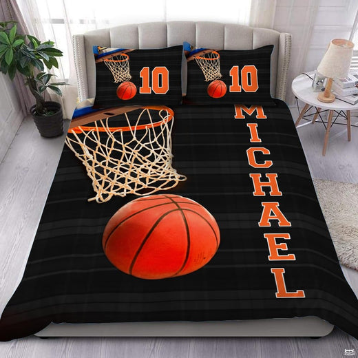 Basketball rim and net bedding featuring an orange ball dropping through white netting on striped background