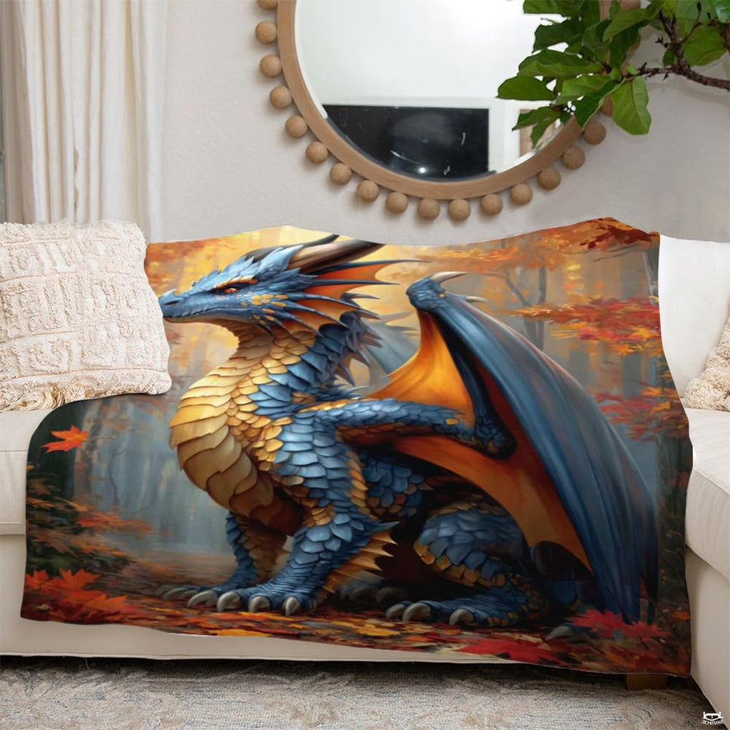 Fantasy blue dragon blanket styled across a grey couch in an entertainment room