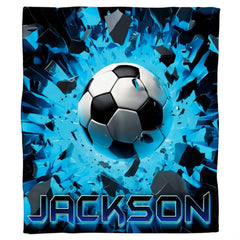 Close up view of soccer ball artwork showing intricate shattered debris and vibrant neon accents.
