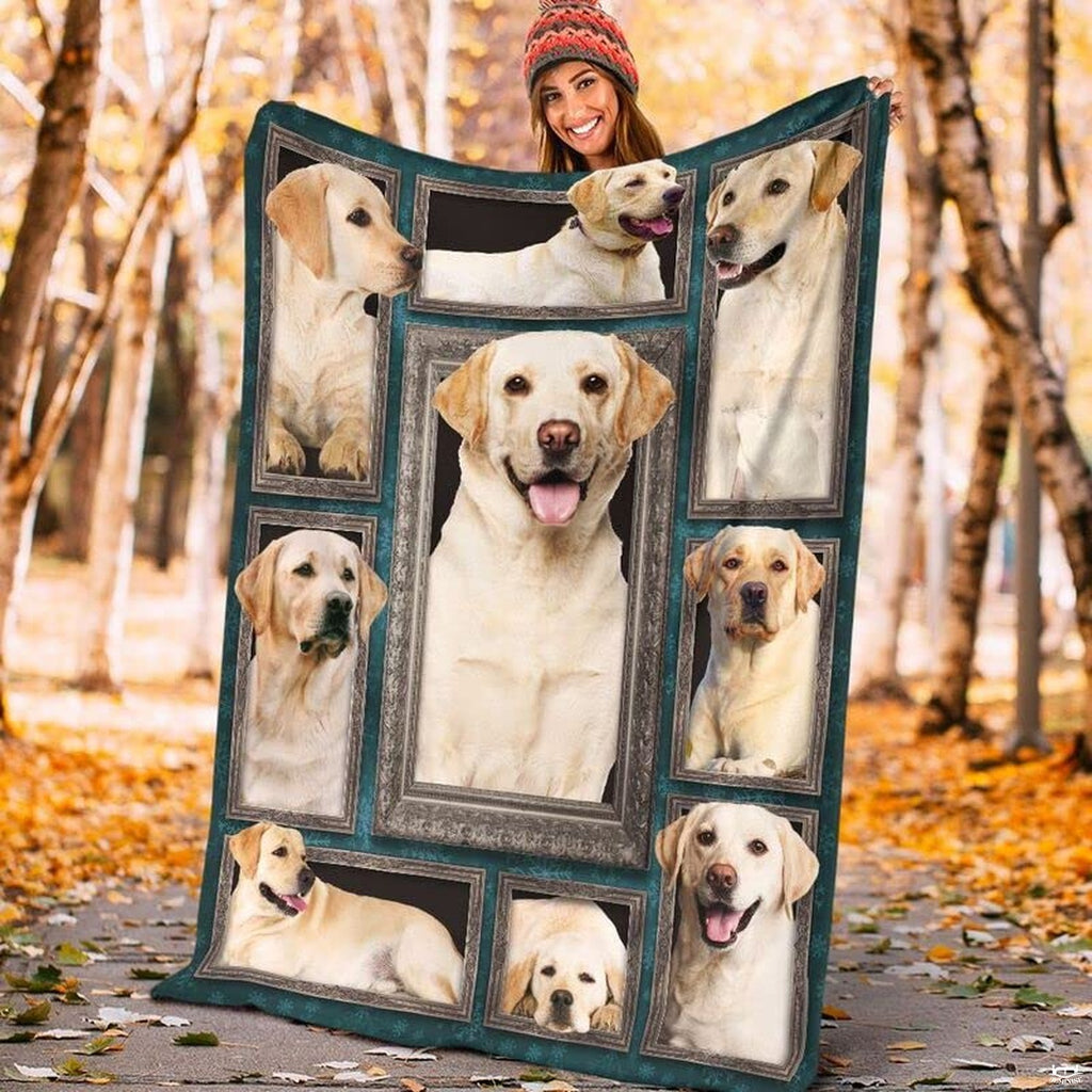 Model displaying the rectangular Yellow Labrador Retriever portrait blanket outdoors in an autumn park.