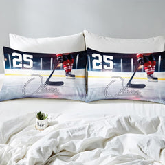 Side angle view of athletic winter sports bedding showing plum purple and crimson red tones on mattress