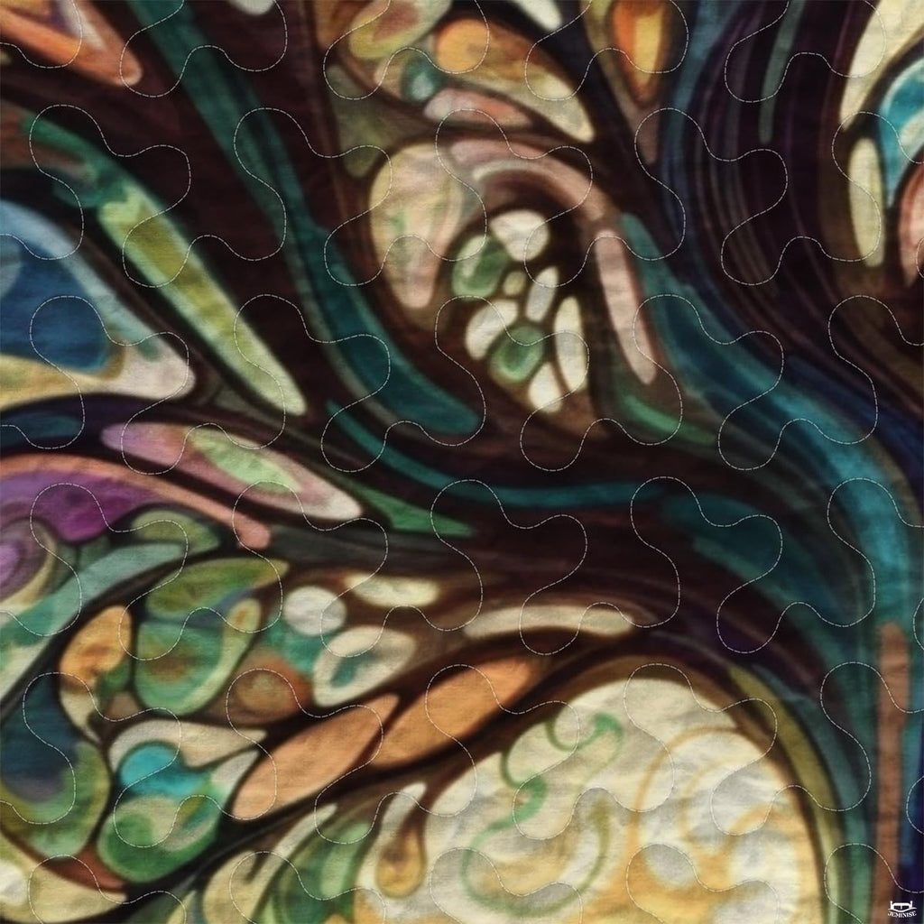 Close-up perspective of botanical bedding detailing jewel-toned glass segments, amber highlights, and lead line art