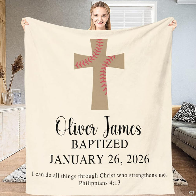 Full view of throw blanket held up, showing baseball lacing cross, cursive name, and milestone typography.