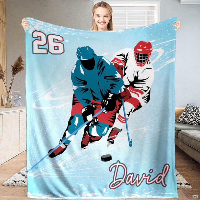 Ice hockey players rink action throw blanket featuring two skaters and black puck on light blue ice