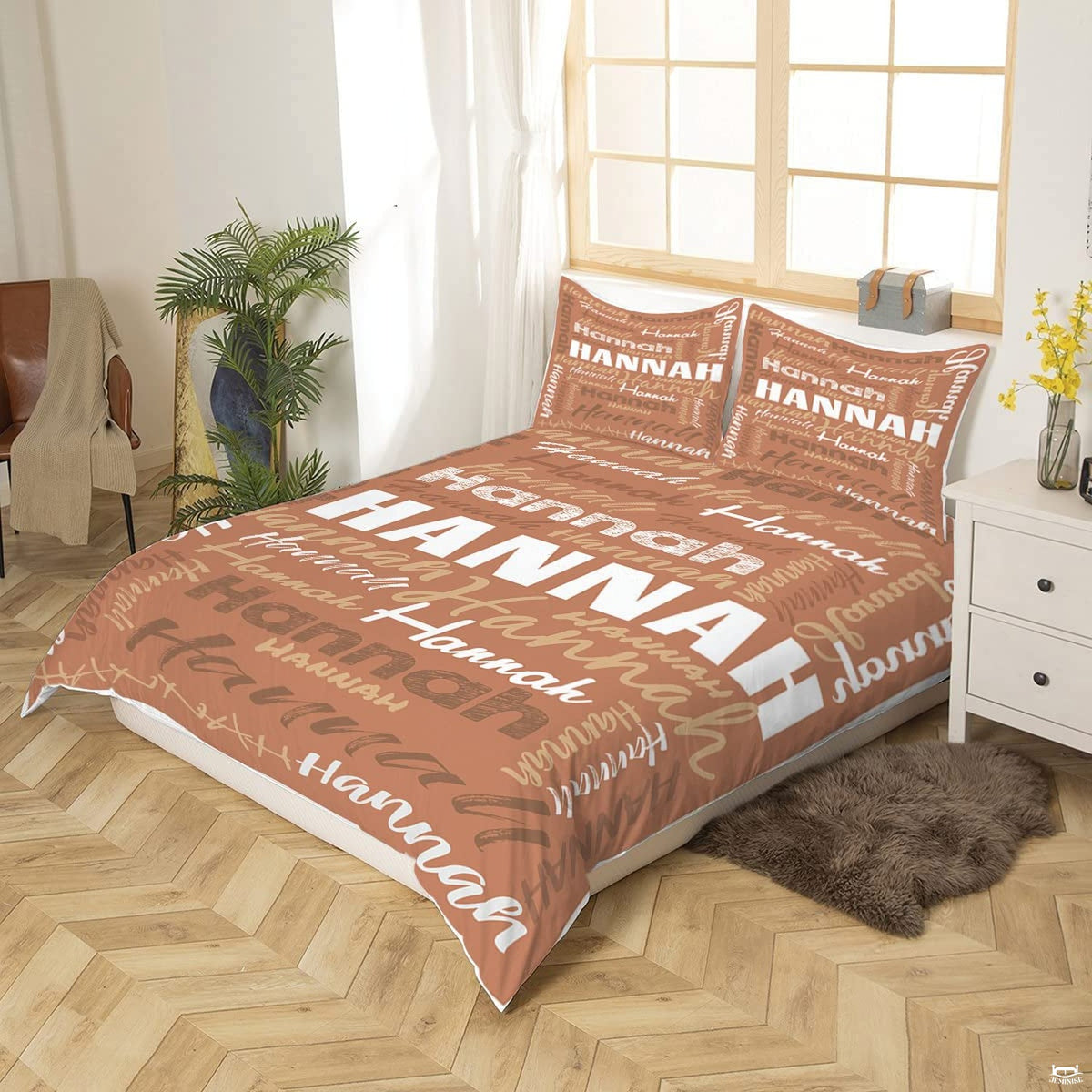 Close-up perspective of terracotta typography bedding showing textured chalk lettering and brushstrokes