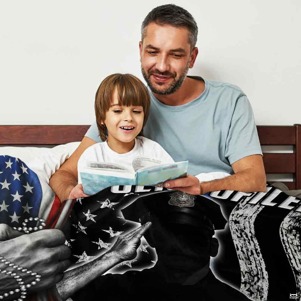 Close-up of badge crest and thin blue line tribute graphics on thematic accent bedding set.