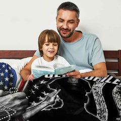 Close-up of badge crest and thin blue line tribute graphics on thematic accent bedding set.
