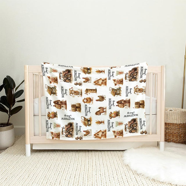 Country farm nursery throw blanket draped over an armchair in a rustic nursery